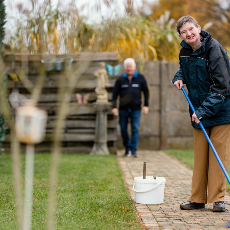 Boarder and foster dad together in garden